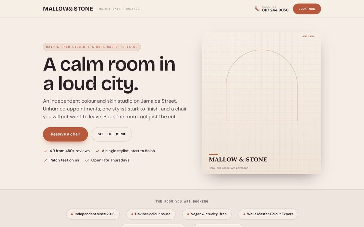 The Mallow & Stone demonstration site: a soft plaster and clay hero reading 'A calm room in a loud city', with a reserve-a-chair button and an arched editorial image panel.